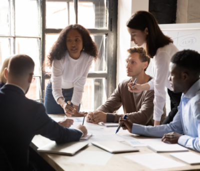 A PR team presenting a crisis communication strategy to a healthcare executive group.